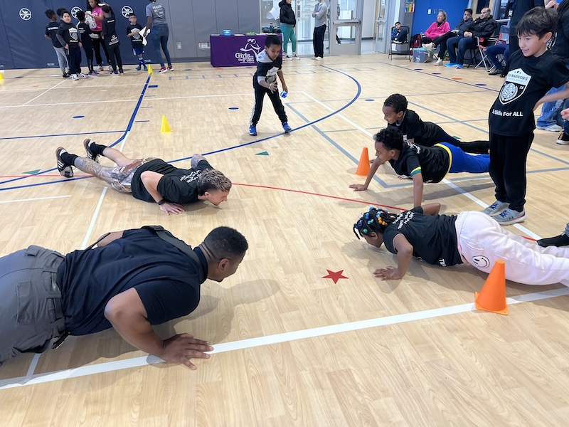 Kids doing fitness drills and push-ups
